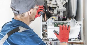 HVAC technician inspecting a home heating system, ensuring efficiency and performance.