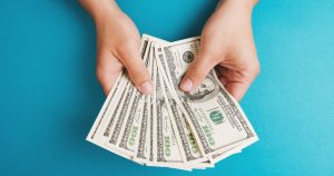 hands holding money