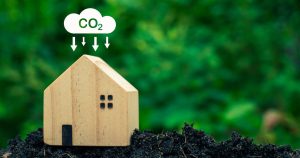 lower emissions icon over model wood house